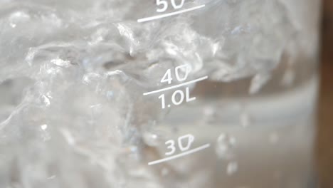 water boiling in a glass measuring cup
