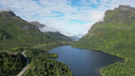 scenic road through fjord in grindoya, lofoten islands, norway - aerial 4k circling