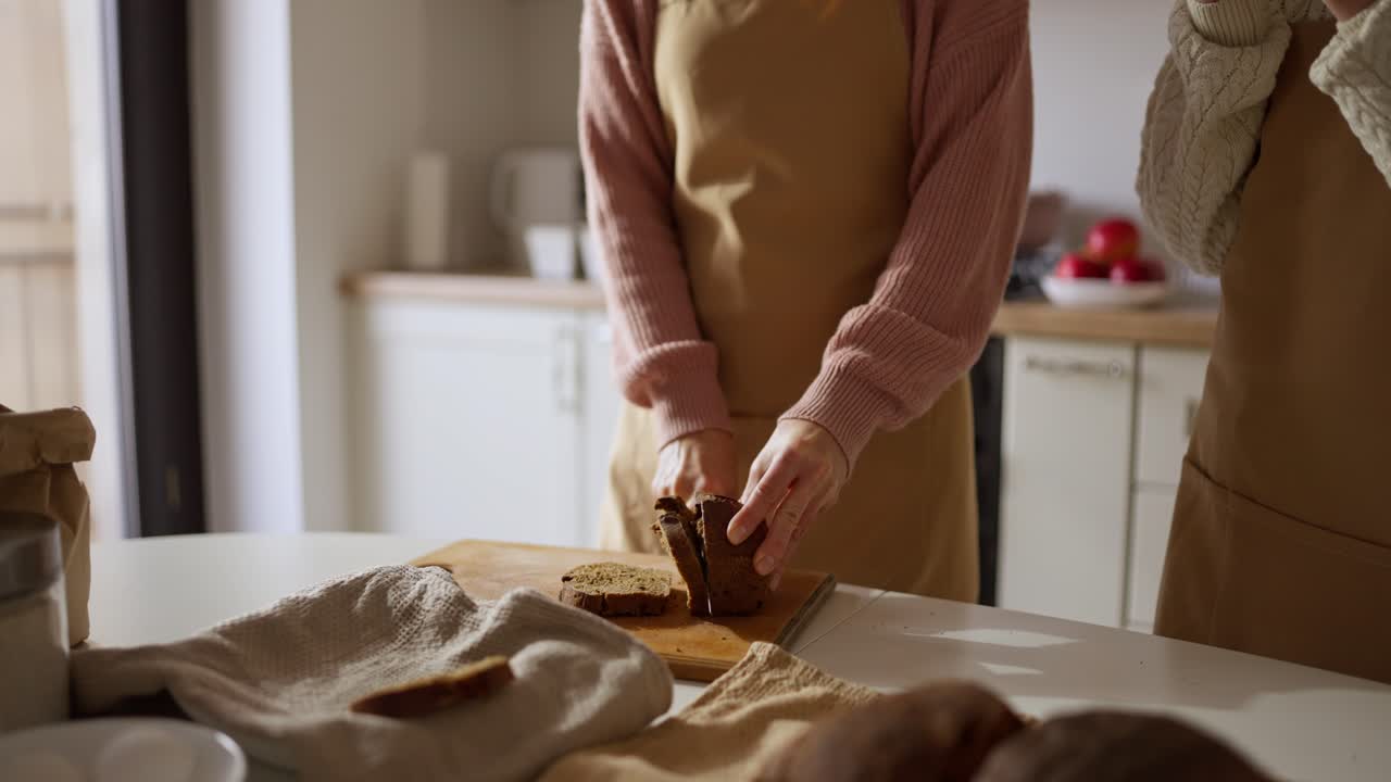 People baking bread in a kitchen