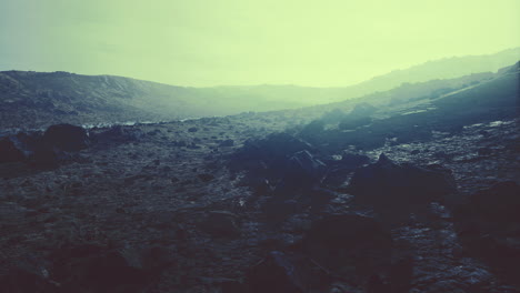 dramatic volcanic landscape at twilight with mysterious green hues