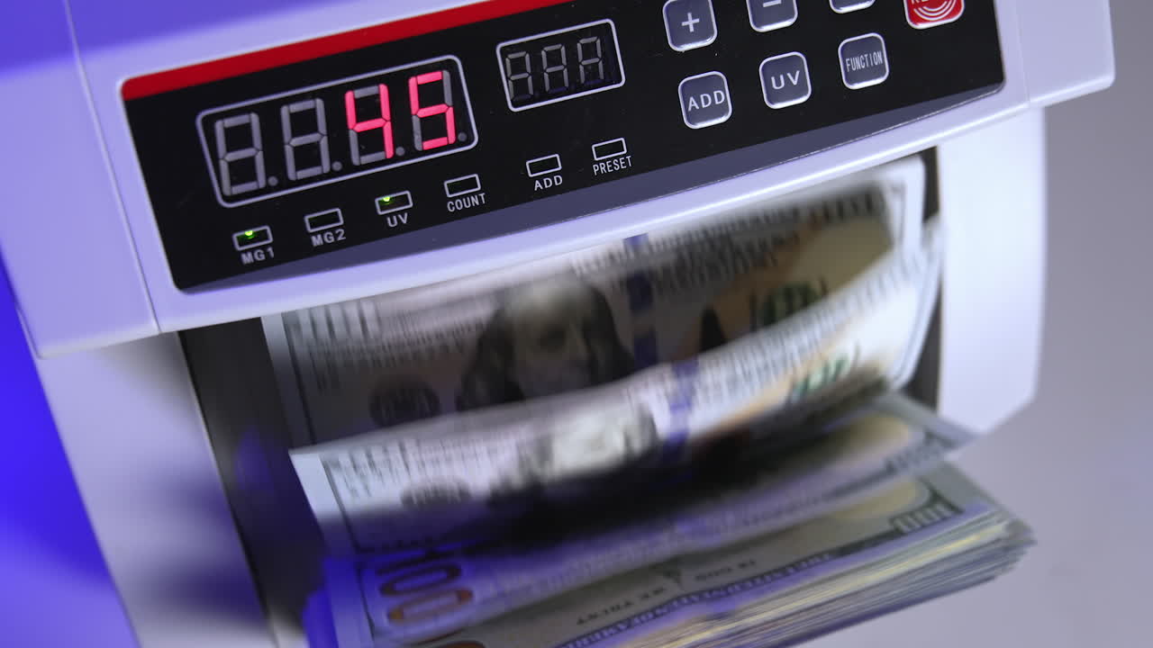 Money counting equipment for paper money calculation. Automatic mechanism for bank financial operations.