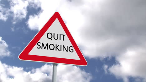 quit smoking sign against blue sky