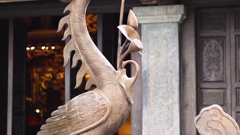 detailed view of ornate bronze crane statue