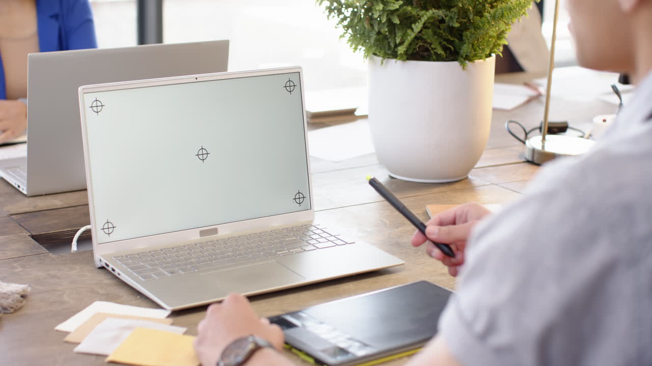 On video call, stylus and laptop, designer, interior design project at desk, copy space, at office