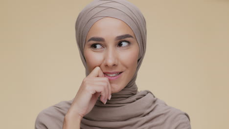 woman in hijab, thoughtful expression