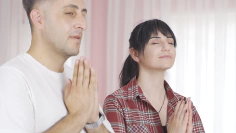 praying married couple.