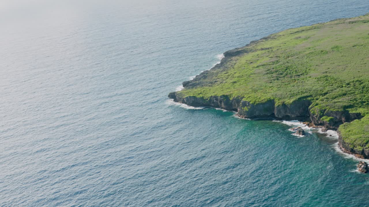 Bird's eye view of an island through an airplane's window