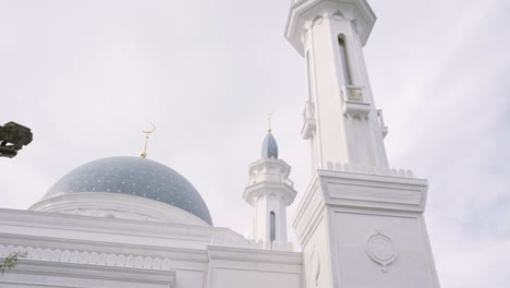 white mosque with dome and minaret