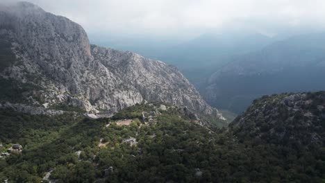 Daytime-Aerial-view-over-Cloudy-mountains-drone-panoramic-shot-of-Thermessos,-Antalya,-Turkey