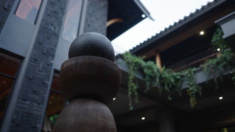 stacked sphere sculpture in a modern architectural setting