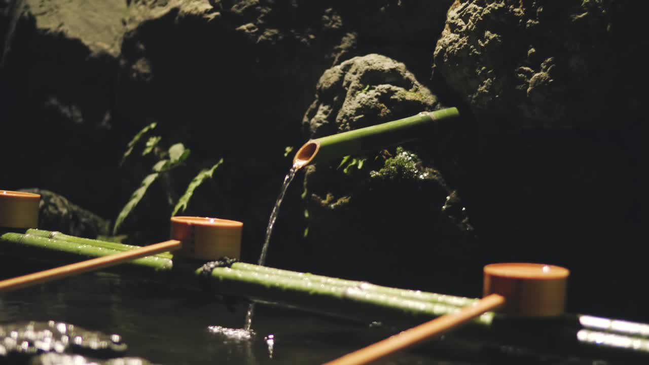 Temizuya - Water Flowing In The Washing Basin At The Kifune Jinja Shrine In Kyoto, Japan. - close up shot