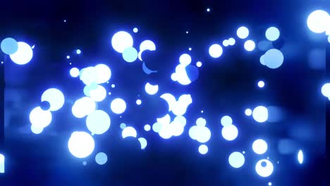 glowing blue balls flash and fly in shiny room. 4k abstract 3d background of luminous spheres in dark shiny camera. beautiful motion background in a color tone. bulbs light up and go out randomly.