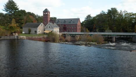 stunning aerial push in on the sparhawk grist mill on the royal river in yarmouth, maine