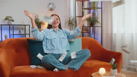 money cash dollar rain falling on woman celebrating success winning good news lottery jackpot luck