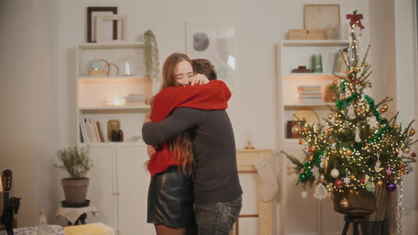 couple hugging each other in living room