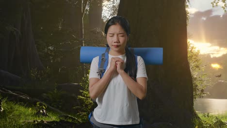 praying woman in the forest