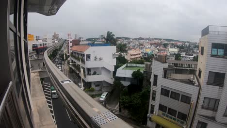 monorail and commuter trains departing station from passenger viewpoint