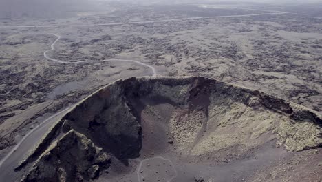 aerial shot of volcanic landscape, craters and frozen lava