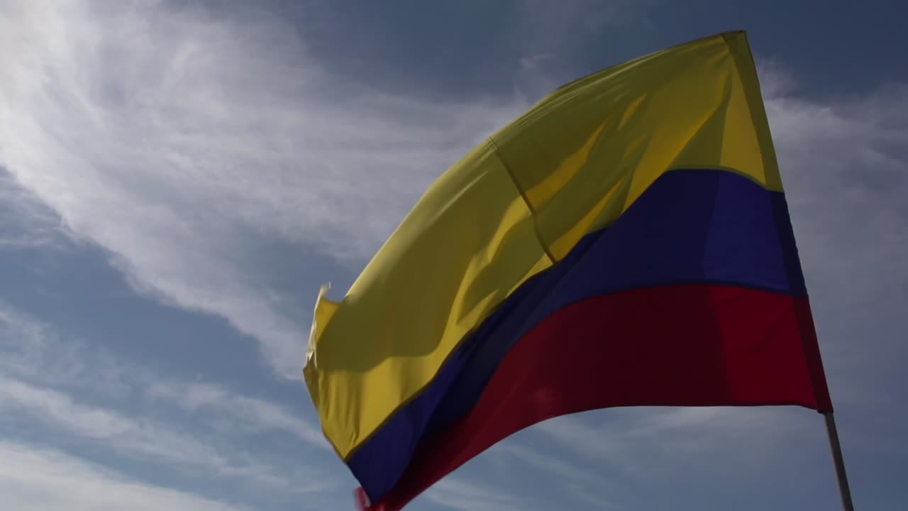 A large Colombian flag in the wind