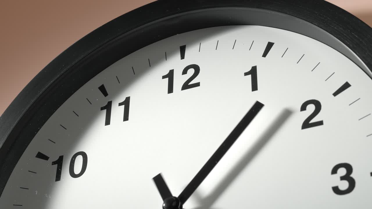 Clock Face on Cream Beige Wall in Time Lapse