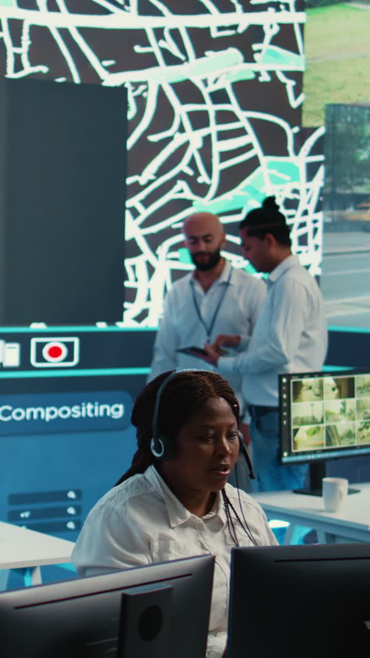 Team of Operators Monitoring City Traffic and Security Footage in Control Room
