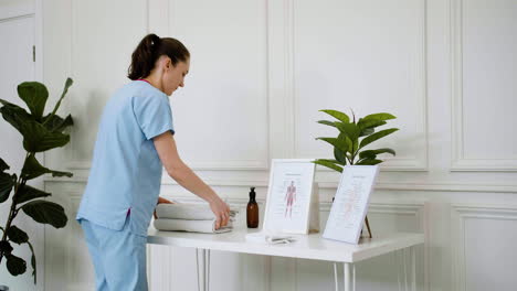 physiotherapist preparing the massage room