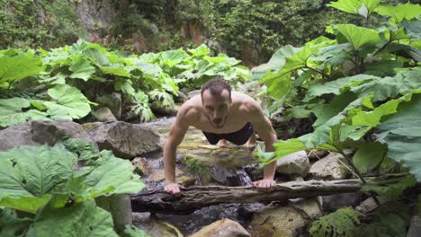 Sport-in-untouched-nature.-Man-doing-push-ups.