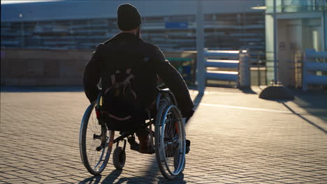 man in wheelchair outdoors