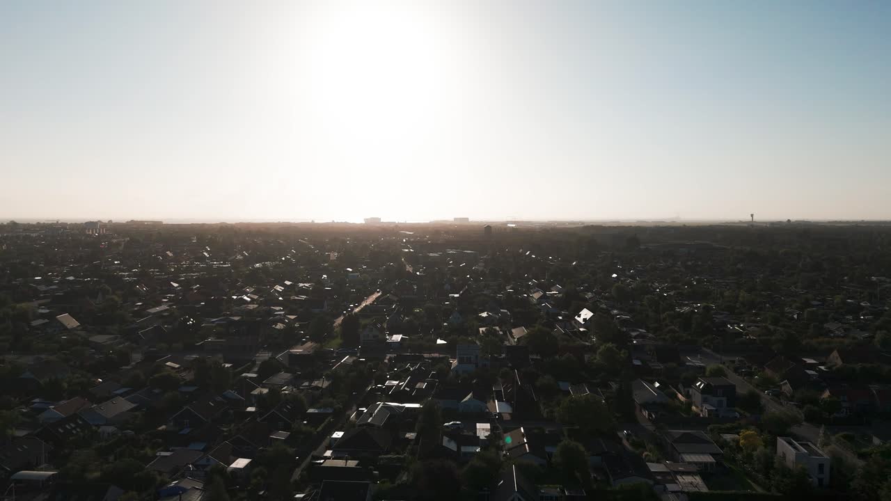 Scenic aerial view over Copenhagen building rooftops during bright evening