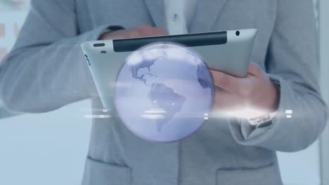 Animation-of-grey-globe-over-hands-of-businesswoman-using-tablet