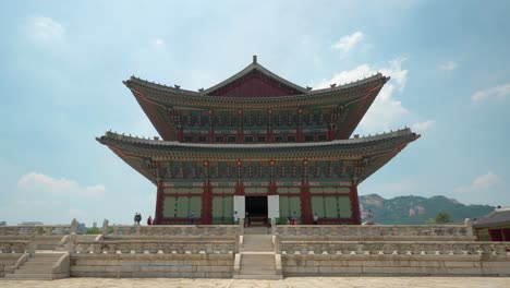 geunjeongjeon hall - tourists walking in front of geunjeongjeon king's residence - copy space