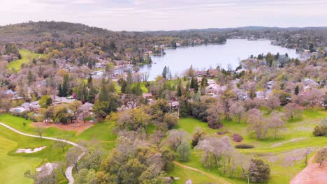 lake of the pines luxury golf neighborhood in auburn, california - surrounded by beautiful green pine and assorted trees, vivid bright green golf course and nature