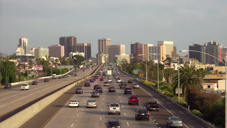 Traffic-moves-along-a-California-freeway-near-San-Diego-with-airplanes-landing-overhead-1