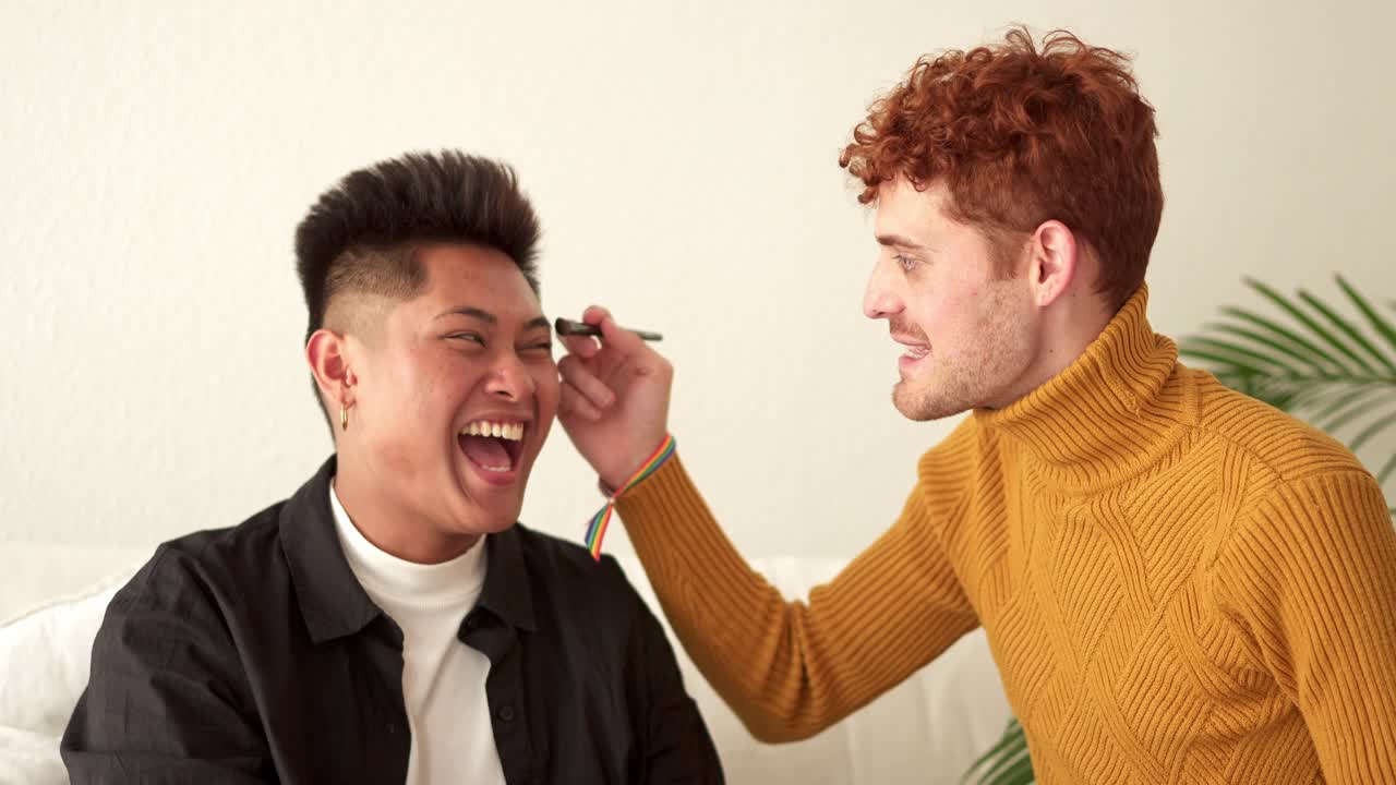 Happy Gay Couple Laughing Playfully at Home