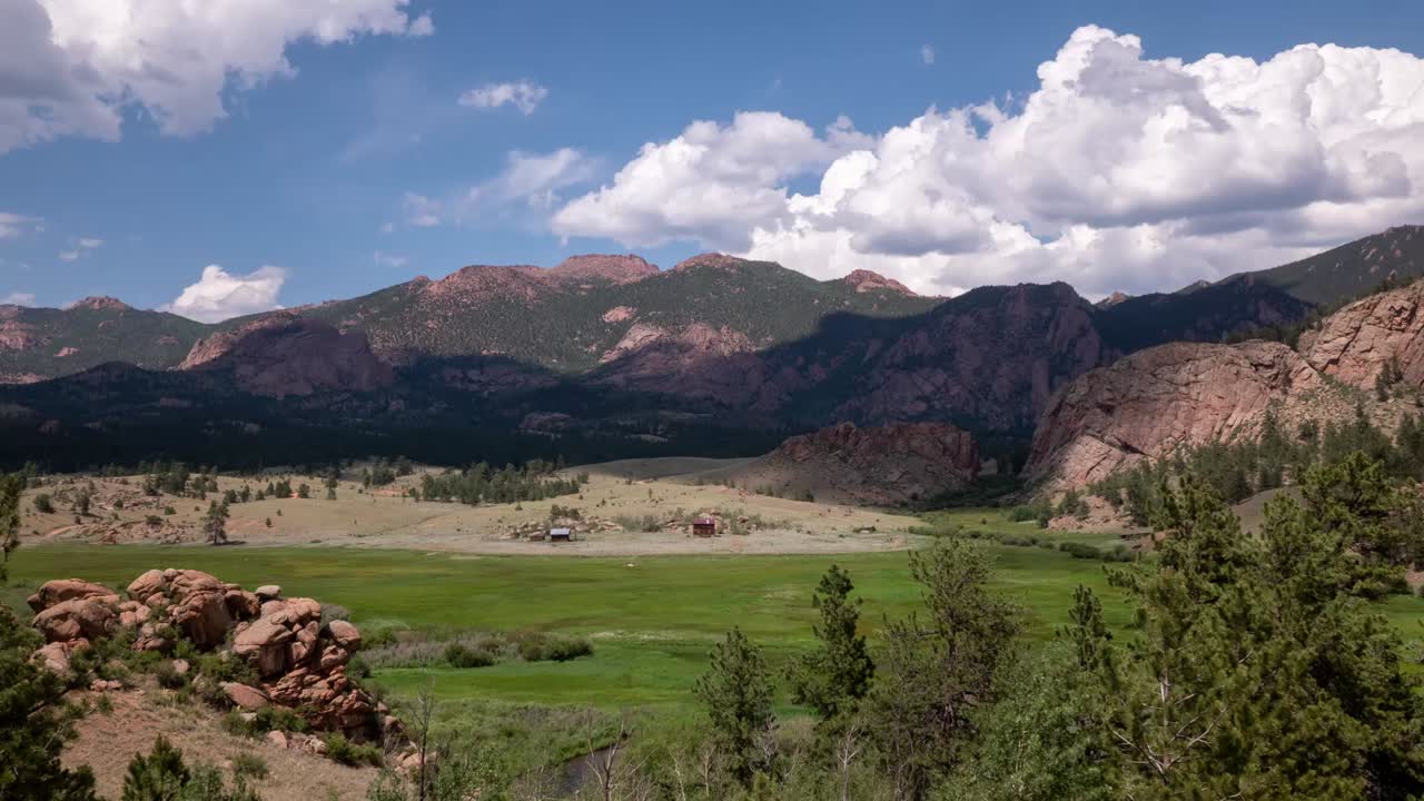 Time lapse of a big mountain and field in Colorado