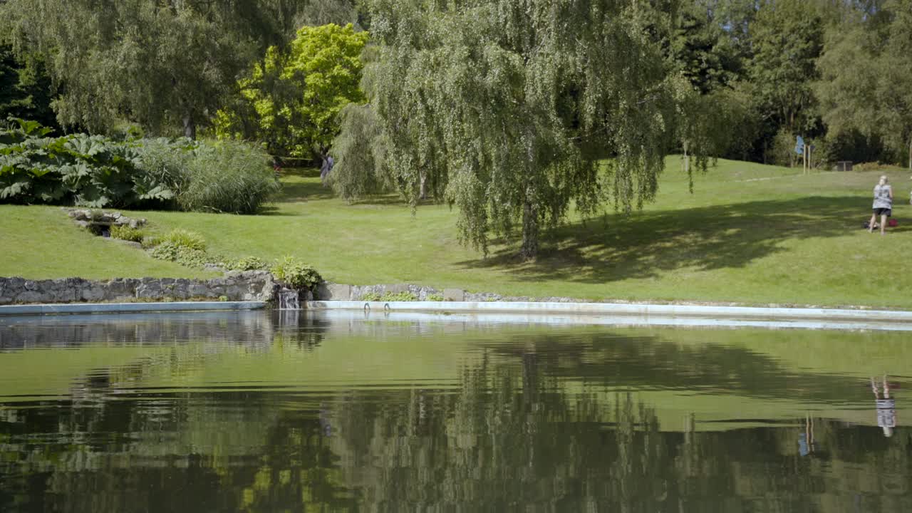 Static shot of small waterfall in a pond at Chartwell, a country house near Kent, England where Winston Churchill lived