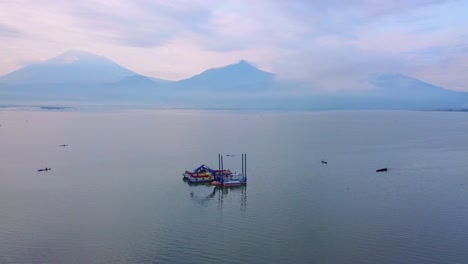 Aerial-view-of-dredger-boat-with-fishing-boats-all-around