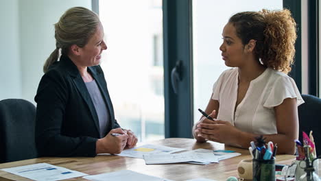 discussing paperwork in the office