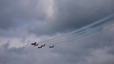 the patrulla aguila is the aerobatic team of the spanish air force. they fly side by side from top to bottom at the air show called airpower