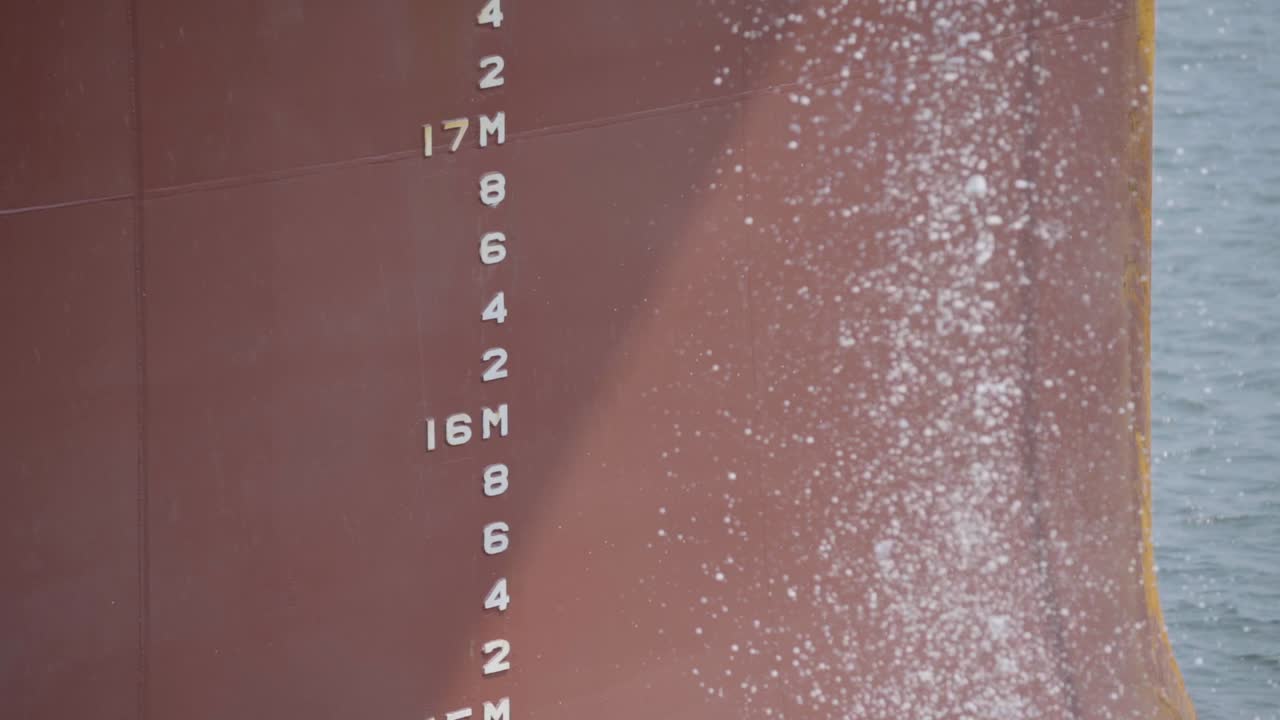 Ballast Water Discharge From A Cargo Vessel At Daytime