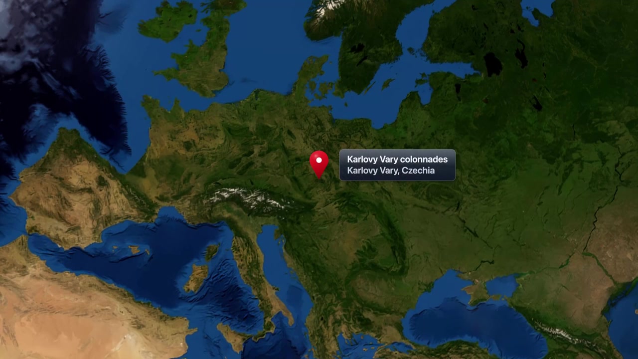 Satellite view zooms from rotating planet Earth into Karlovy Vary Colonnades in Czechia. Includes NASA public domain imagery.