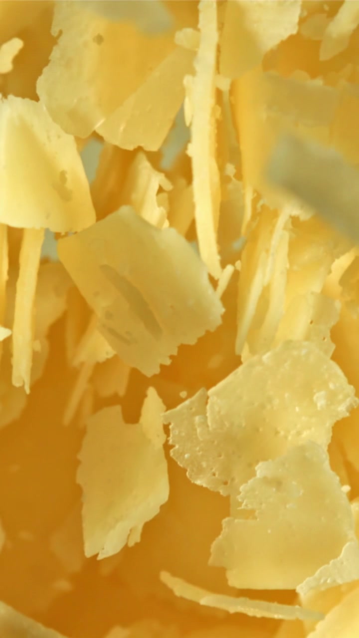 Parmesan Cheese Shavings Falling in Slow Motion