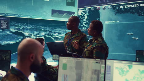 special operations engineers examine surveillance footage to gather information