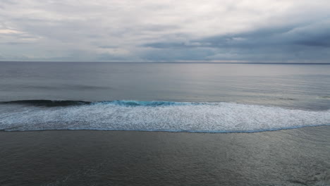 slow motion footage of foamy tides from suth pacific ocean approaching shore of beach in cook islands.
