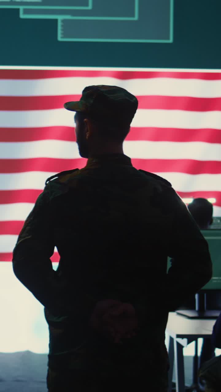 Soldier in Uniform Standing Before a Waving American Flag