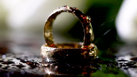 Wedding-rings-on-the-table-with-water-effects