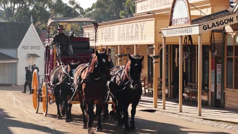 carriage moves through historic street with shops