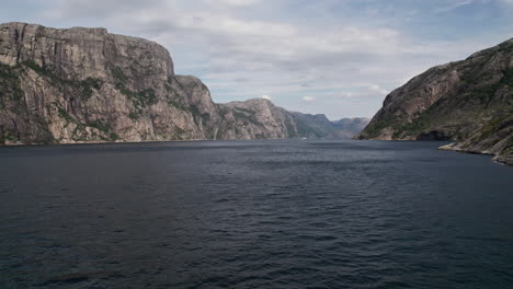 Aerial-shot,-flying-low-over-the-water-of-Lysefjord,-Norway