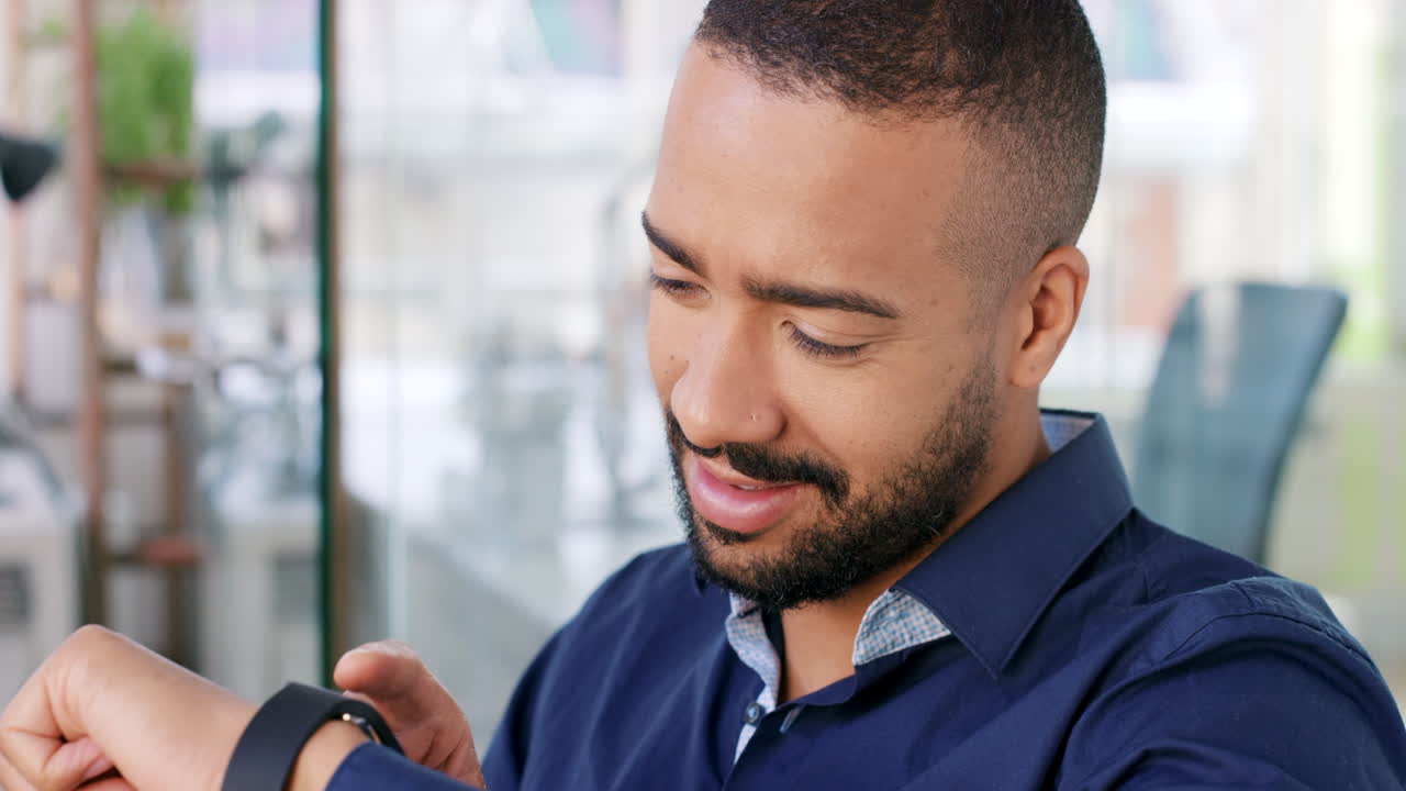 Businessman Checking Smartwatch in Modern Office