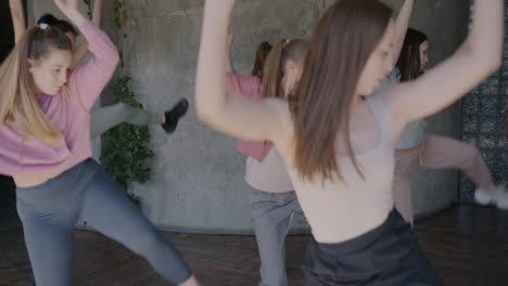 group of women dancing in a studio